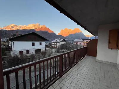 a balcony with a view of the mountains at Al Monte Zelo in Agordo