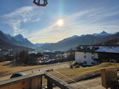 a kite flying in the sky over a mountain at Meleres 11 in Cortina dʼAmpezzo