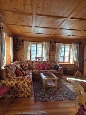a living room with a couch and a table at Meleres 11 in Cortina dʼAmpezzo