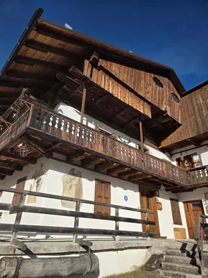 a wooden balcony on the side of a building at Meleres 11 in Cortina dʼAmpezzo