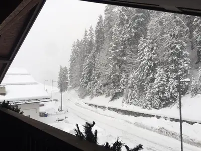 a view from a window of a snow covered mountain at Penthouse with view 2 bedrooms free parking in Cortina dʼAmpezzo
