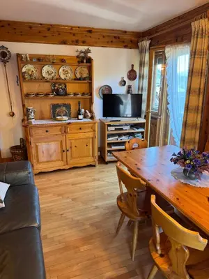 a room with two bunk beds and a desk at Casa Faloria in Cortina dʼAmpezzo