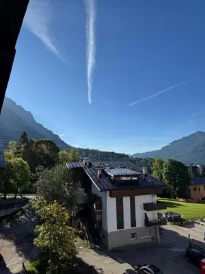 a house with a roof on top of it at Casa Faloria in Cortina dʼAmpezzo