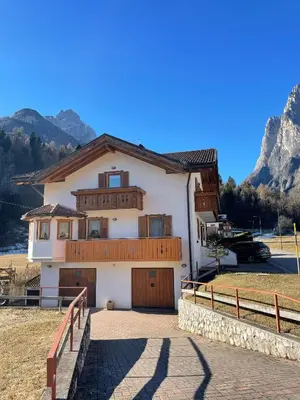 a house in the mountains with a driveway at Casa Marilu' in Taibon
