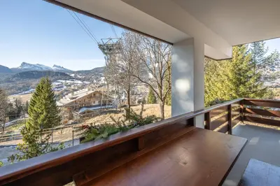 a balcony with a view of the mountains at Apartment Capriol by My Villa Collection in Cortina dʼAmpezzo