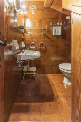 a bathroom with a sink and a toilet at Casa Funivia 2, with panoramic balcony in Cortina dʼAmpezzo
