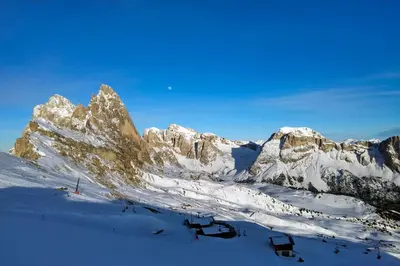 a snow covered mountain range with a ski slope at Chalet Center Pic in Ortisei