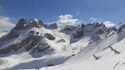 a snow covered mountain with a ski lift at Chalet Center Pic in Ortisei