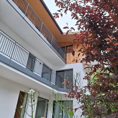 an external view of a building with a balcony at Chalet Center Pic in Ortisei