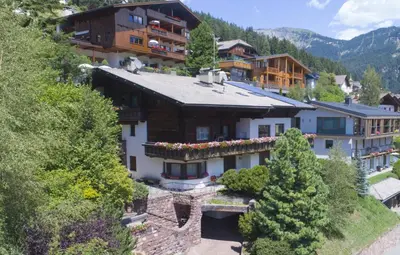 an aerial view of a hotel in the mountains at Apartments Meisules in Ortisei