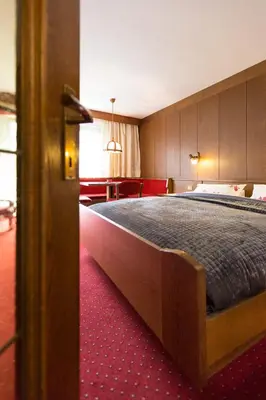 a bedroom with a large bed in a room at Apartments Meisules in Ortisei