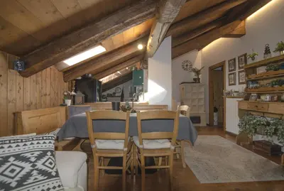 a dining room with a table and chairs at Un angolo di comfort nel pieno centro di Cortina in Cortina dʼAmpezzo