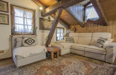 a living room with a couch and two chairs at Un angolo di comfort nel pieno centro di Cortina in Cortina dʼAmpezzo
