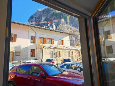 a view from a window of a parking lot at Casa Iole - Alpine Stay Apartments in Predazzo