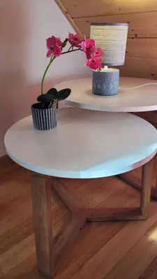 a white table with two flowers on top of it at Maison Cavalese - Wild Forest, tranquillità a due passi dal centro in Cavalese