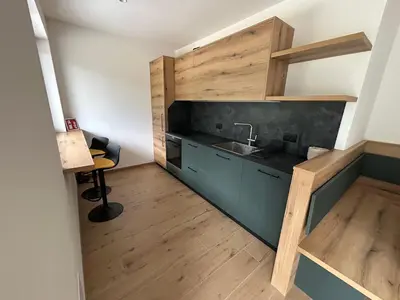 a kitchen with a sink and a counter at FIEMME IN VISTA Apartments in Ziano di Fiemme