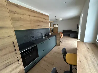 a kitchen with a sink and a counter top at FIEMME IN VISTA Apartments in Ziano di Fiemme