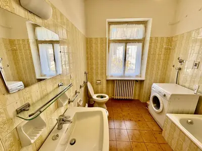 a bathroom with a sink and a toilet and a sink at Villa Augusta-central apartment in Cortina dʼAmpezzo