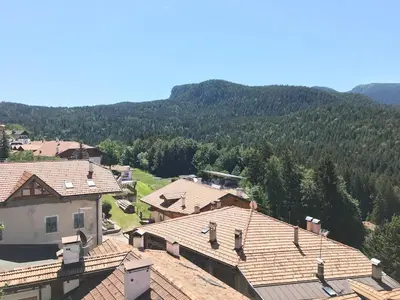 an aerial view of a village with mountains in the background at Casa Rita Roen - Ruffrè-Mendola in Ronzone