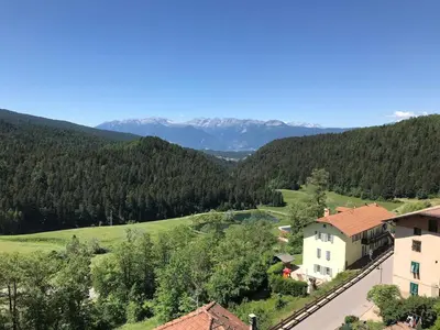 a view of a house in a valley with trees at Casa Rita Roen - Ruffrè-Mendola in Ronzone