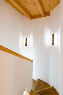 a room with white walls and wooden ceilings at Awakening in the Dolomites between Pelmo and Antelao in Borca di Cadore