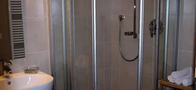 a bathroom with a shower and a sink at Ferienwohnung Matzhof in Nova Levante