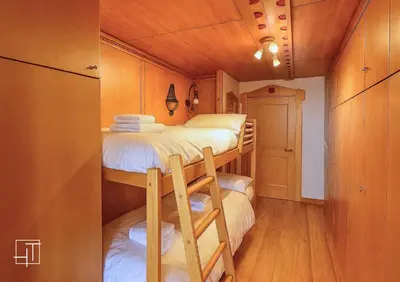 a small room with two bunk beds in it at HT - Esclusivo chalet a Cortina d'Ampezzo in Cortina dʼAmpezzo