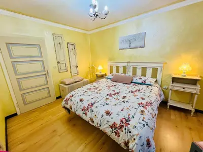 a bedroom with a bed and a dresser in it at Trilli House in Rocca Pietore