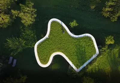 an overhead view of a park with trees and grass at Freiform Private Guesthouse in Chiusa