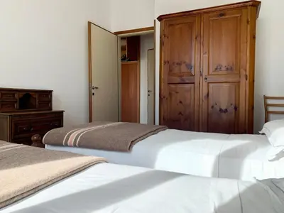 two beds sitting next to each other in a bedroom at Apartment in the Center of Cortina in Cortina dʼAmpezzo