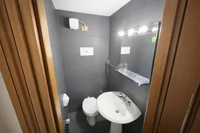 a small bathroom with a sink and a toilet at HT - Mansarda panoramica nel cuore di San Vito in San Vito di Cadore