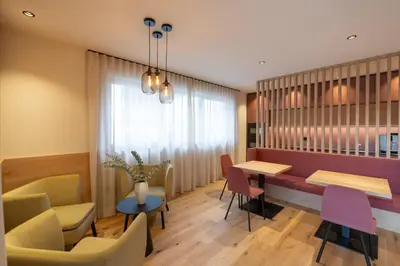 a dining room with a table and chairs at Maratscherhof in Eppan an der Weinstrasse ST. Pauls