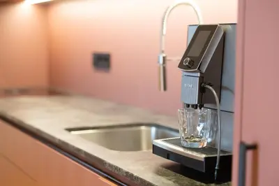 a kitchen counter with a coffee machine on a counter top at Maratscherhof in Eppan an der Weinstrasse ST. Pauls