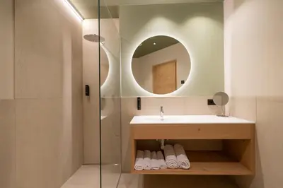 a bathroom with a sink and a mirror at Maratscherhof in Eppan an der Weinstrasse ST. Pauls