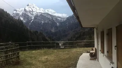 a view of a snowy mountain range from a house at Fontanelle La Casa Dei Nonni in Elmo