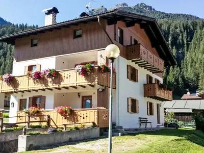 a large building in a town with a mountain at Apartment Cristina by Interhome in Campestrin