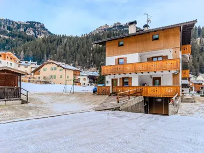 a large building with a balcony on the side of it at Apartment Cristina by Interhome in Campestrin