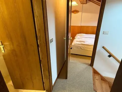 a room with a door leading to a bedroom at Apartment Roacia-5 by Interhome in Alba di Canazei