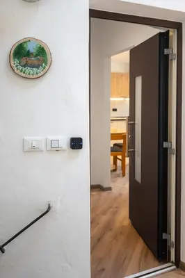 an open door with a picture on the wall at Dolomiapartments - Bosco Fontana 1 in Predazzo