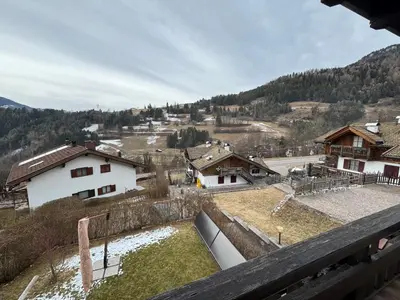 a view from a balcony of a village with houses at Appartamento Al Settimo Cielo in Tesero