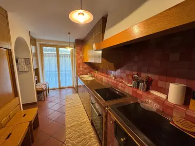 a kitchen with a sink and a counter top at Appartamento Al Settimo Cielo in Tesero
