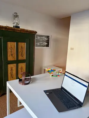 a laptop computer sitting on a white desk at Ca Costanza in Cortina dʼAmpezzo