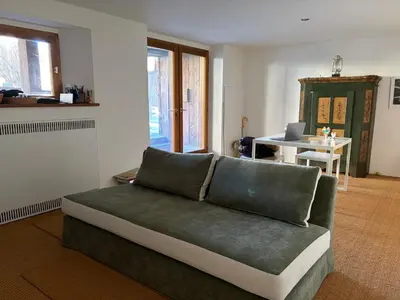 a living room with a couch and a table at Ca Costanza in Cortina dʼAmpezzo