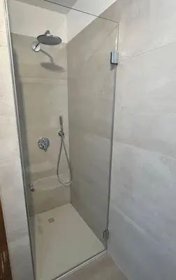 a shower with a glass door in a bathroom at Primule 2 Cavareno in Cavareno
