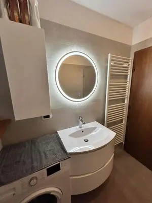 a bathroom with a sink and a mirror at Primule 2 Cavareno in Cavareno