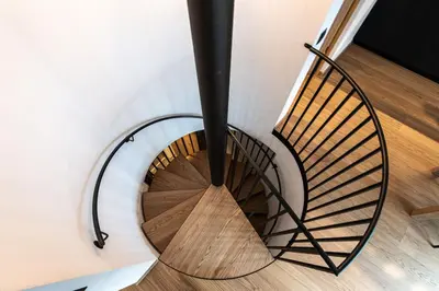 a spiral staircase in a house at Senner Nature Stay in Riscone