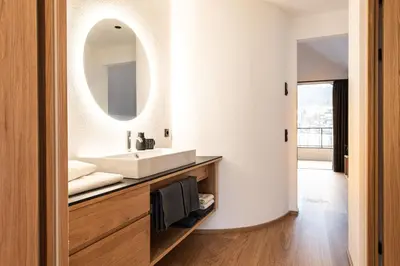 a bathroom with a sink and a mirror at Senner Nature Stay in Riscone
