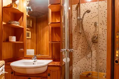 a bathroom with a sink and a shower at Alpine Living Cortina in Cortina dʼAmpezzo