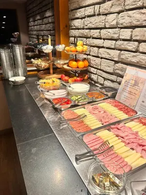 a buffet with many different types of food on a counter at Hotel Angerer in Bressanone