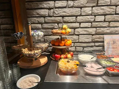 a buffet with fruit and other food on a table at Hotel Angerer in Bressanone